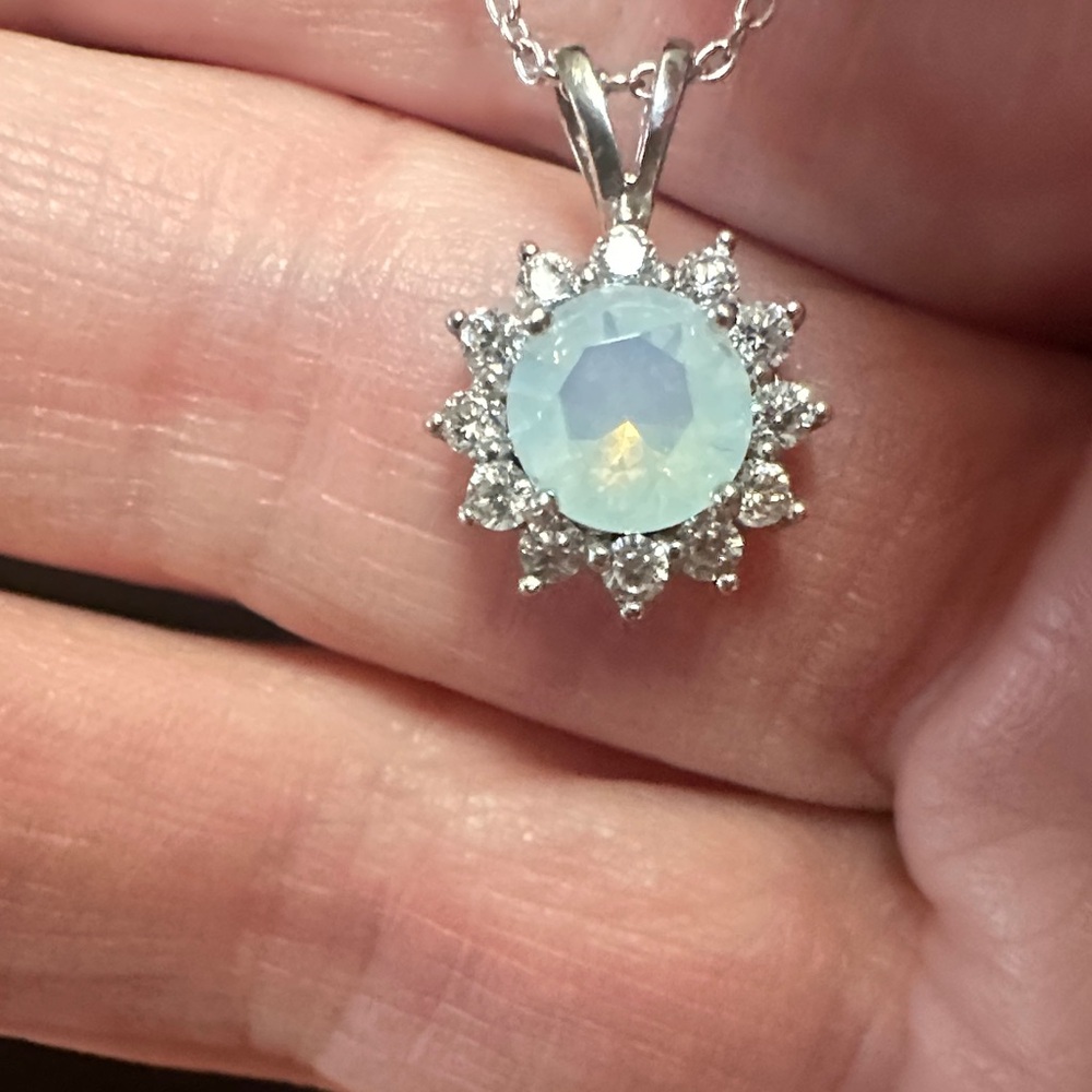 Moonstone with crystal starburst surround. 925 Silver chain, bale & pendant.